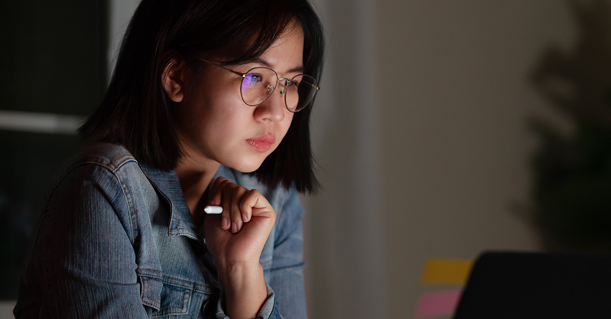 Asian woman studying computer