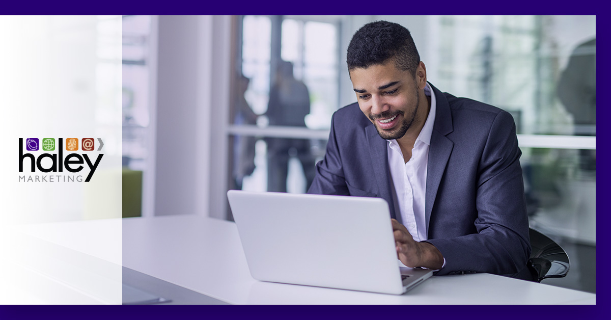man on laptop wearing suit
