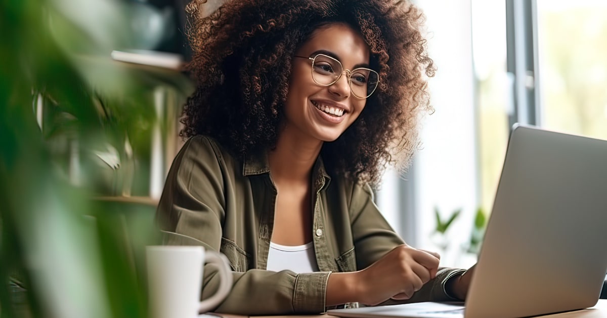 Woman smiling at laptop