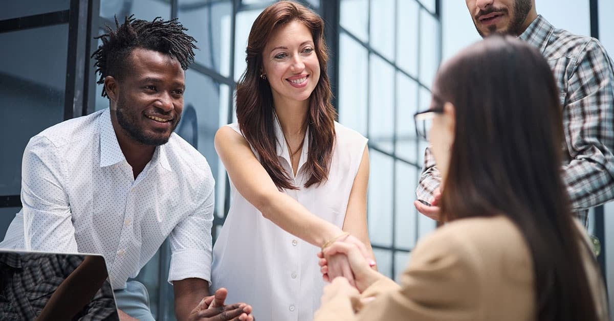 people shaking hands over marketing strategy